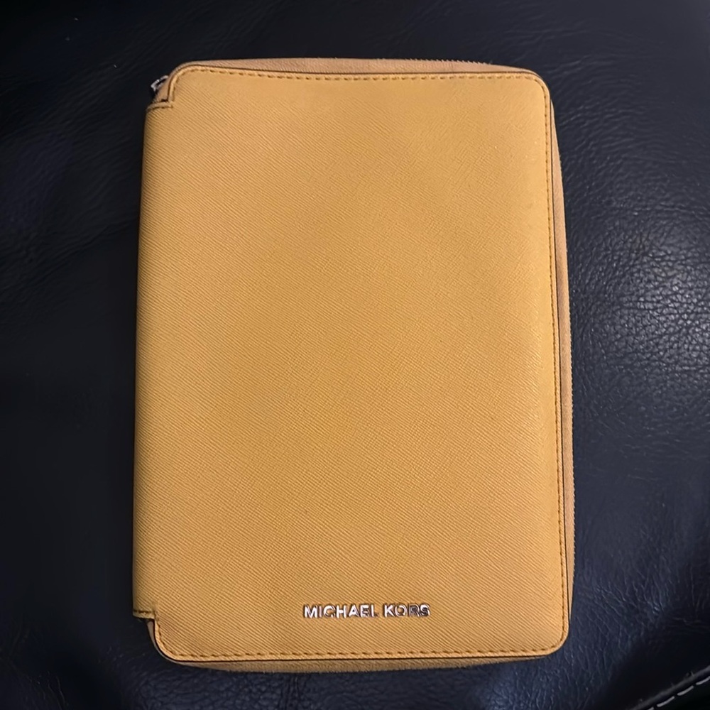 Michael Kors leather small IPad case yellow color. Good condition